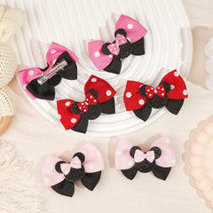 Qearl mouse ears hair clip red closeup highlighting soft fabric and clip grip