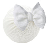 QFV double bows headband in bright colors for newborn photos.
