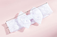 Qiansail baby headband worn on newborn demonstrating gentle soft stretch fit