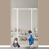 Qonimm 57-inch tall cat gate in doorway blocks pets and kids safely