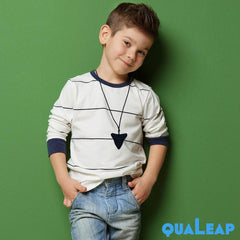 QuaLeap Amber Xtra Tough shark tooth necklace worn by child during sensory activity