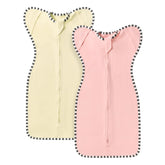 QUENESS Transition Swaddle pink shows soft, breathable cotton for gentle baby sleep.
