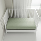 QuickZip crib sheet base wraparound secures standard mattresses for a snug, stable sleep surface