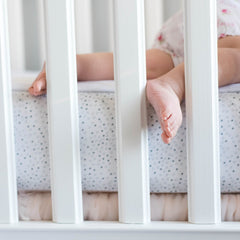 QuickZip standard crib mattress compatibility image showing 52x27 sizing