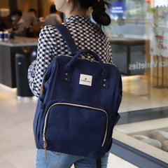 Ramhorn diaper bag backpack blue side pocket, convenient storage for bottles and toys.
