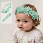 Rannyrena cyan lace flower headband closeup, soft stretch for secure comfort.