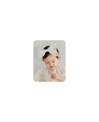 Rannyrena lace bow headband white closeup shows soft stretchy fabric for newborn comfort
