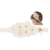 Rannyrena lace flower bow headband closeup showing soft stretch for comfy wear
