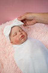 RATIVE headband cap closeup on newborn shows soft fabric and secure fit