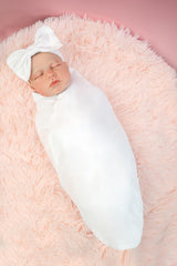 RATIVE swaddle blanket with headband cap white on baby provides calm comfort