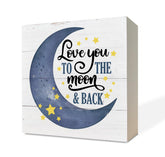 Razpah Love You to the Moon star moon sign on a desk adds a soothing nursery focal point.