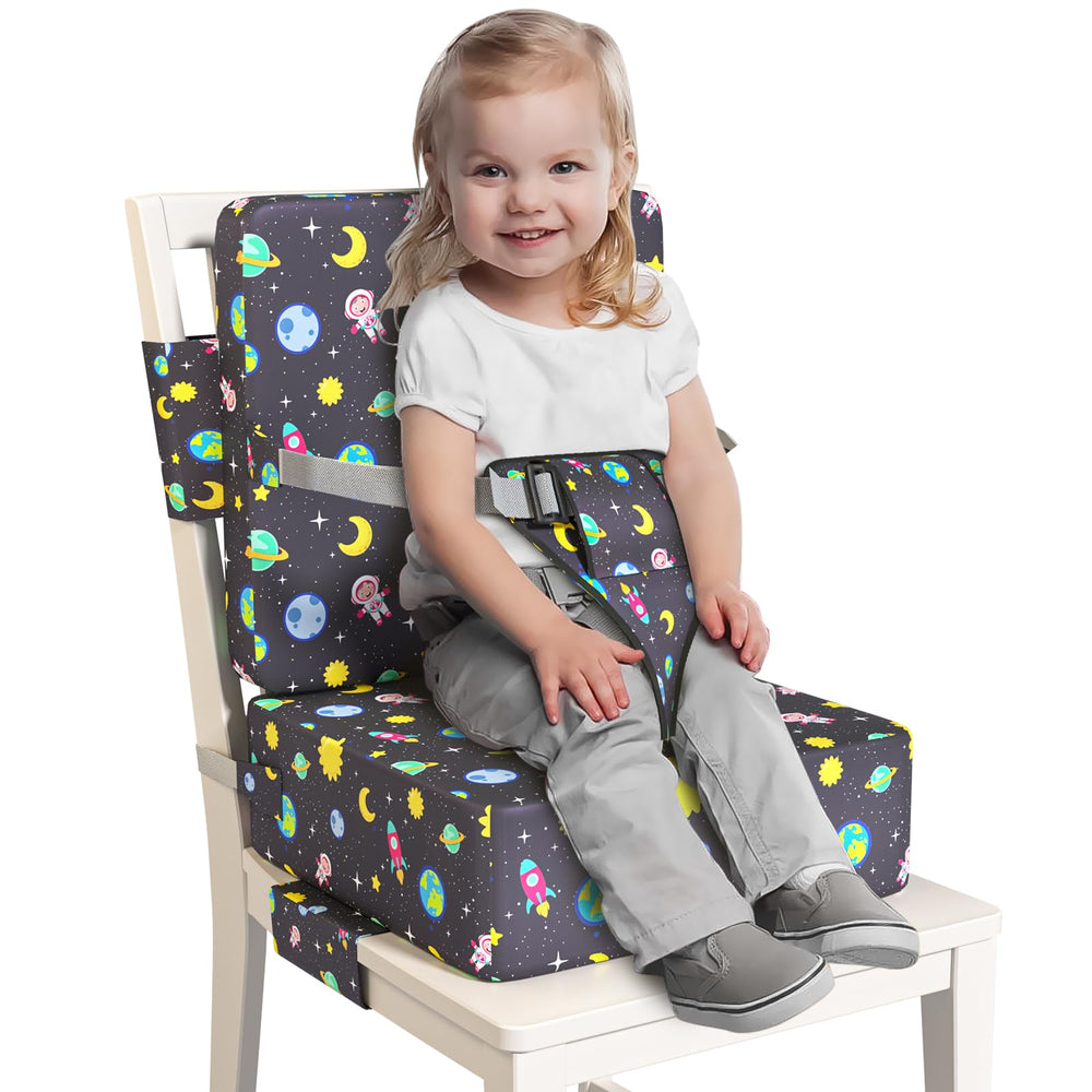 Redcoutt booster seat on dining chair with extended straps for secure fit.