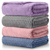 Reginary 4-pack fuzzy blankets in assorted colors for nursery warmth.