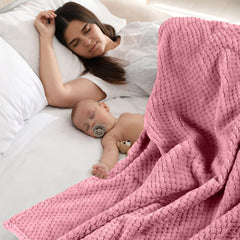 Reginary baby blanket 30x40 used as car seat cover for travel warmth.