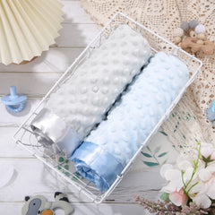 Reginary baby blanket in nursery setting illustrating swaddling and crib-time coziness