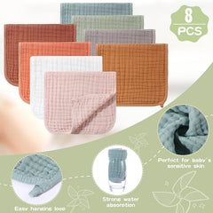 Remagr baby burp cloths folded around baby for clean outfits.