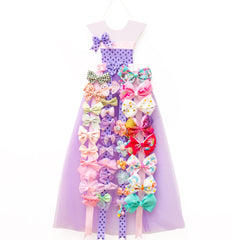 RengaoRise bow holder with princess dress display keeping bows organized and accessible.