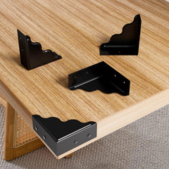 RFORPLY black metal corner guard protecting a wooden desk corner against daily wear.