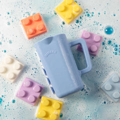 Rinzee bath cup sticks to tiles, helping keep bath area neat and accessible.