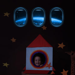 Robmoda glow-in-the-dark space decals illuminate walls for night-time play.