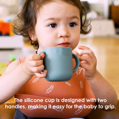 ROCCED baby learning cup features soft rim for gentle sipping.