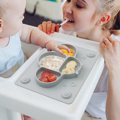 ROCCED placemat suction cups on smooth wood table for stability.