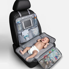 Rohamzen baby changing station folded in car for travel convenience.