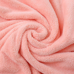ROMASA hooded towel with button closures for secure fit on baby.