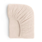 ROMY RO muslin crib sheet in wheat shows soft texture for baby sleep comfort.