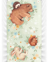 Rookie Humans Enchanted Meadow crib sheet fabric closeup shows soft, breathable cotton sateen texture.