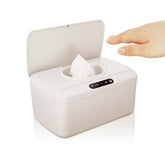 ROUNDS baby wipes dispenser demonstrates automatic lid opening for touch-free, hygienic access.