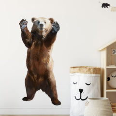 RoyoLam brown bear wall decal in nursery creates cheerful space.