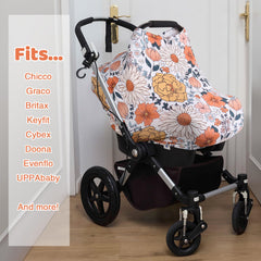 Rquite All-in-1 car seat cover fits snug over a carrier for secure protection.