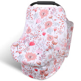 Rquite all-in-1 car seat cover draped over a carrier for private nursing on the go
