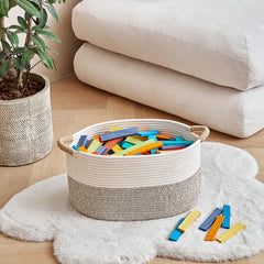 R RUNKA bohemian-style basket blends with decor and stores books.
