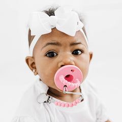 Ryan & Rose Cutie PAT Stage 1 pacifier closeup with soft nipple design.