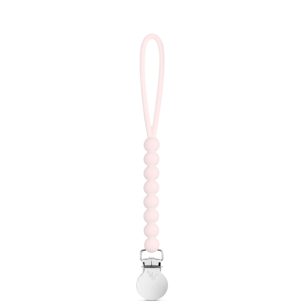 Ryan and Rose Cutie Clip Judy pink silicone pacifier clip closeup showing secure attachment.