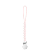 Ryan and Rose Cutie Clip Judy pink silicone pacifier clip closeup showing secure attachment.
