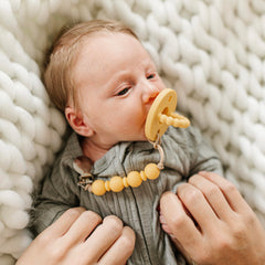 Ryan & Rose Cutie PAT teether handle close-up for easy, comfortable grip.