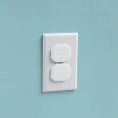 Safety 1st Secure Press plug protectors installed on outlet show a low-profile safety solution.