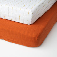 Salt Earth muslin crib sheet elastic corner demonstrates secure no-slip fit.