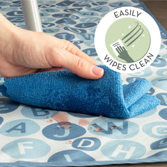 S&T INC 42x42 blue alphabet splat mat laid on the kitchen floor.