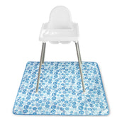 S&T INC Baby Splat Mat under high chair with blue alphabet design for spill protection.