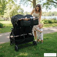Sasha's double stroller organizer features zip pockets for phones and keys.