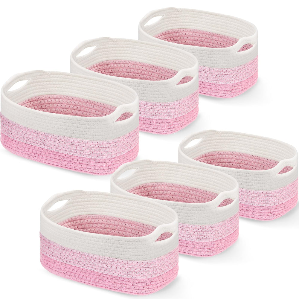 Sawysine six-piece pink and white cotton rope basket set with handles for tidy living room storage.