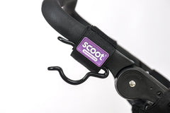 SCOOT The Ultimate Buggy Hook on handlebars demonstrates secure two-hook configuration for versatile carrying
