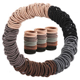 Seiolieliou 200pcs elastic hair ties pack in neutral colors for versatile kid hairstyles.