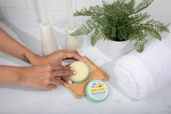 Serendipitous Summer Farms Happy Hiney balm jar with creamy texture for soothing baby skin.