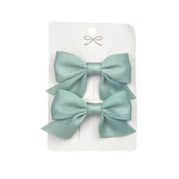 Sevenhead light green bow hair clip showing 2.16-inch ribbon for secure toddler styling.