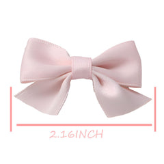 Sevenhead light green bow hair clip pair demonstrates versatile accessory for outfits.